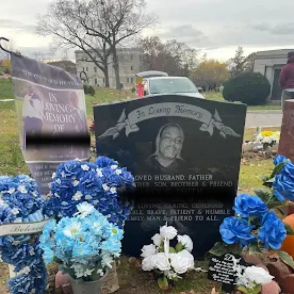 Black granite gravestone in cemetery