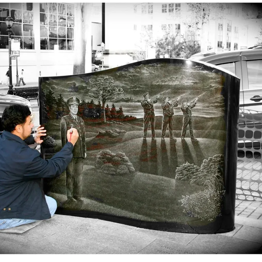Hand etching1 Manny is hand etching a soldier's monument